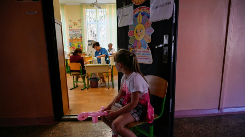 Mobile medical brigade seeks to bring solace to Ukrainian children