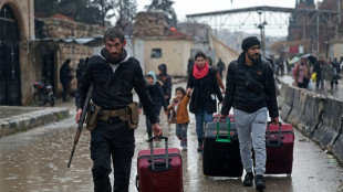Syrian army says stopping Aleppo operations, but Kurds deny fighting over