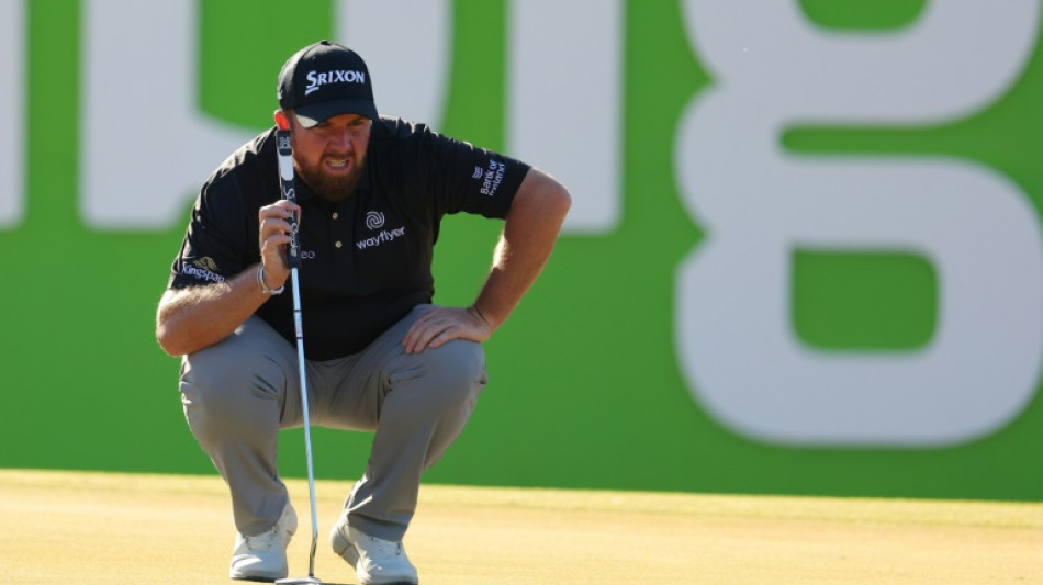 Ireland's Lowry fires 67 after hour's drive to buy putter