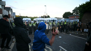 'I can't breathe': clashes erupt after UK police handcuff dying student