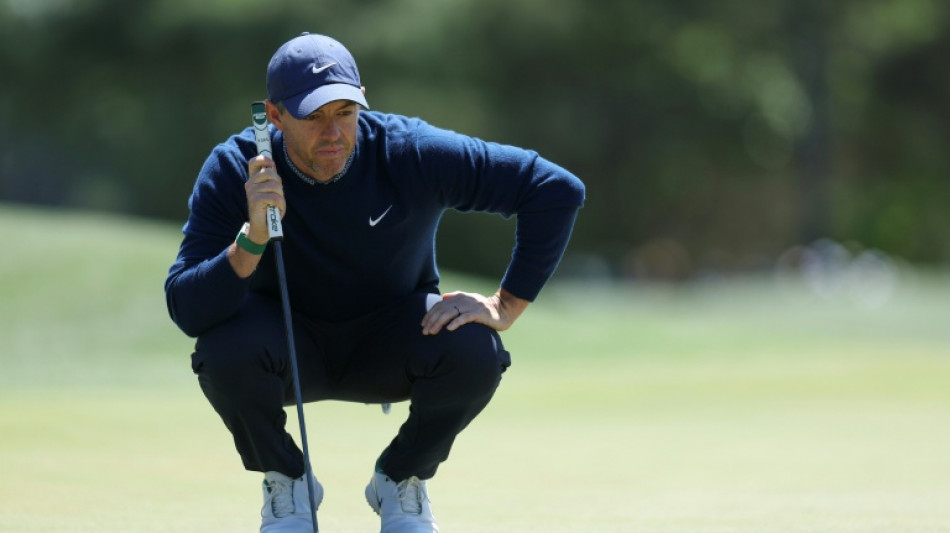 McIlroy's back-nine birdie run grabs share of Masters lead