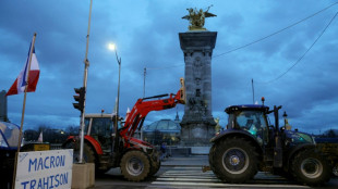 Fuming French farmers camp out in Paris despite government pledges