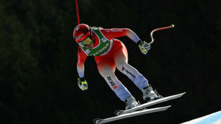 Suter wins as Aicher closes gap on absent Vonn in downhill title race