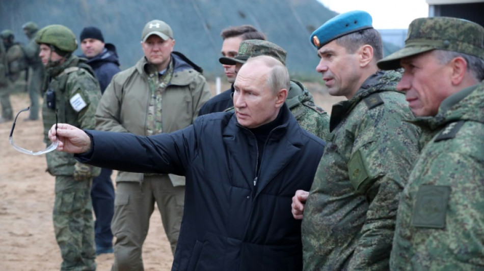 Putin visits military draft training centre