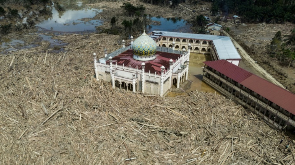 Nowhere to pray as logs choke flood-hit Indonesian mosque 
