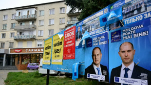 Moldovans vote in tense polls, torn between EU and Russia